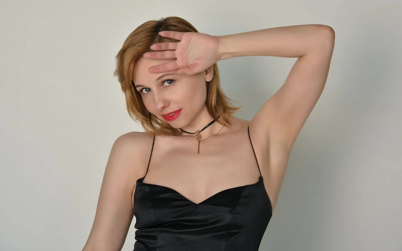 A photo of a woman with an average-sized forehead A photo of a woman with an average-sized forehead